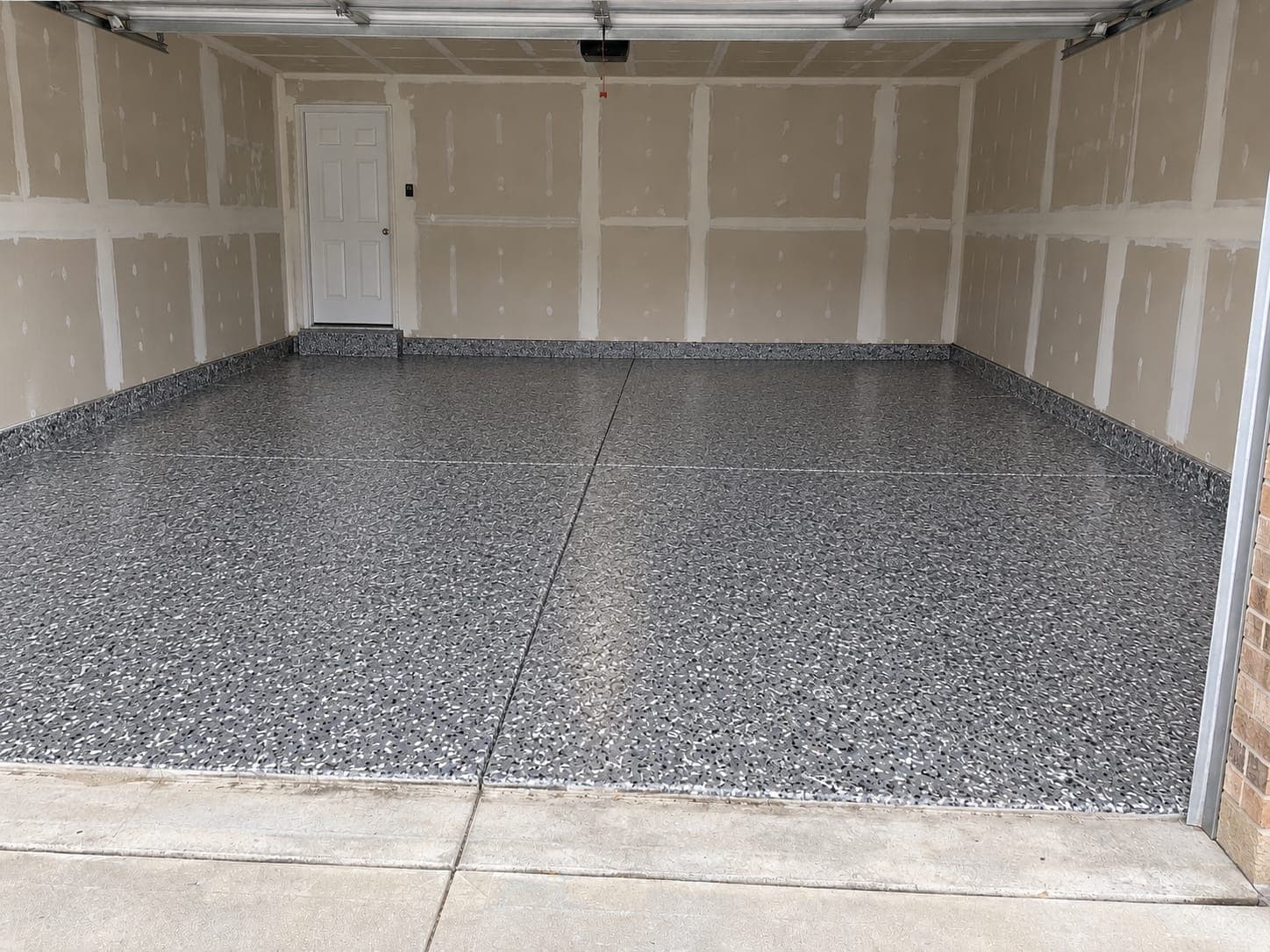 The same garage floor after a full-flake coating