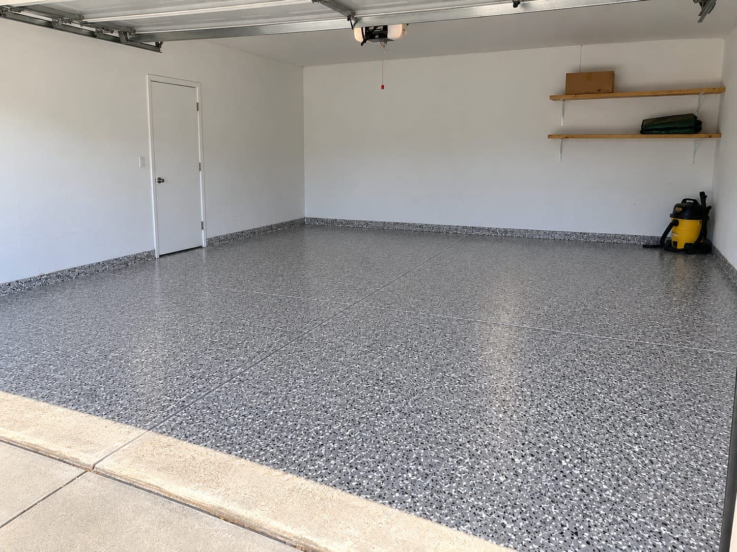 The same garage floor after a full-flake coating