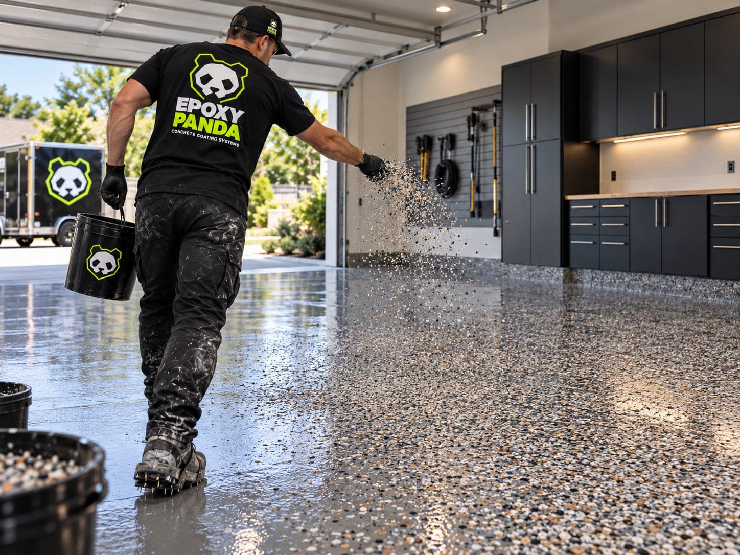 Epoxy Panda crew member broadcasting decorative flake onto a wet coating