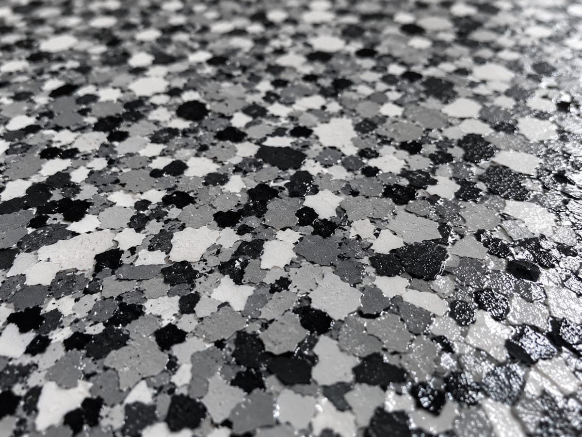 Close-up of a decorative flake garage floor